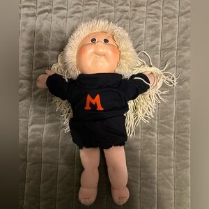 Hasbro Cabbage Patch Doll with Black Outfit and Orange Letter ‘M’ Vintage 1989